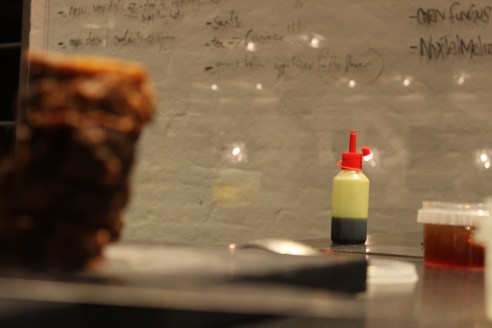 Setting up in the test kitchen. A bottle of pine oil in the background.